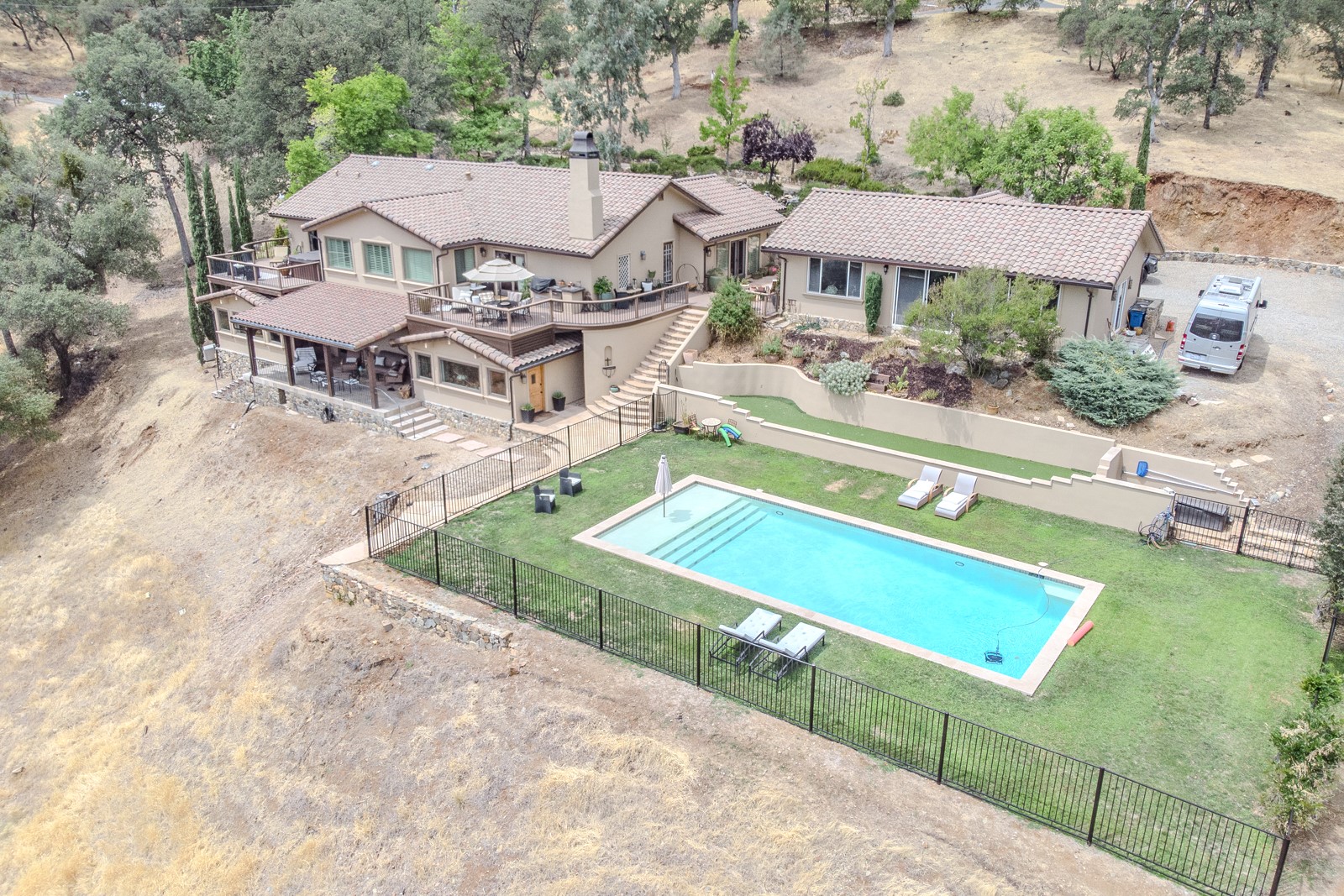 Aerial view of property with pool and outdoor living area