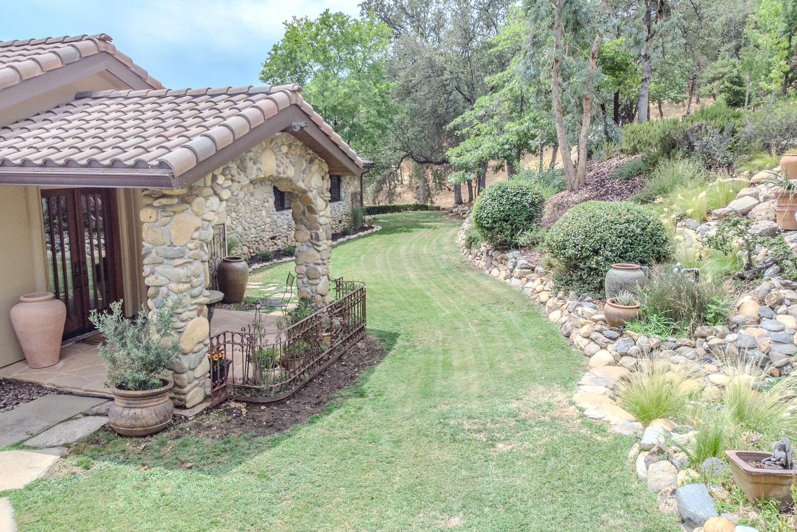 Aerial view of residential property and landscaped grounds