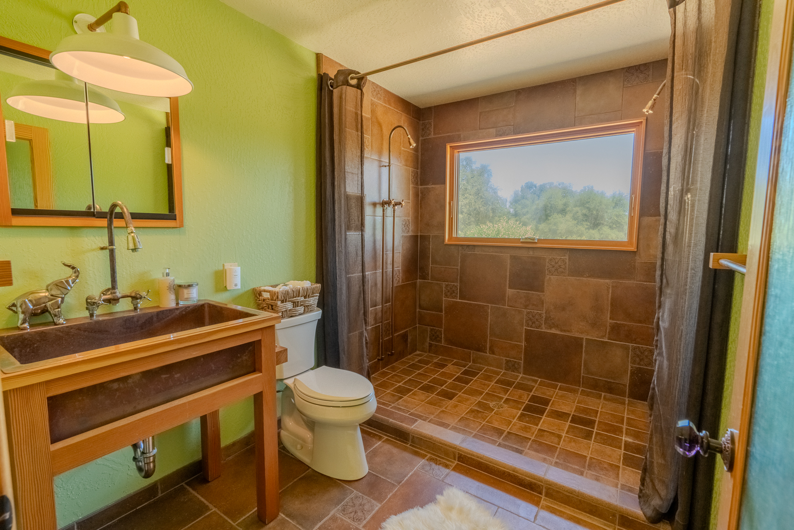 Bathroom with custom tile shower and natural light